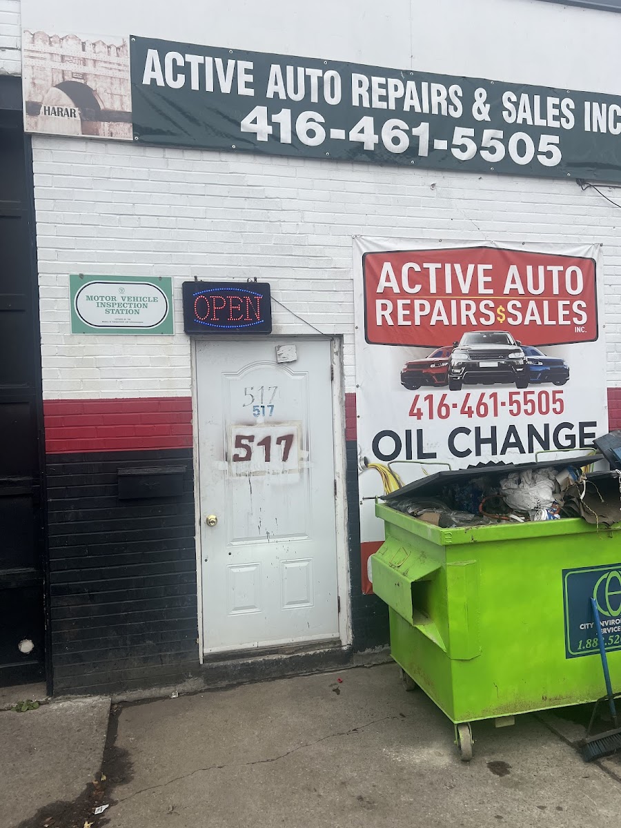 A car being worked on inside Active Auto's service bay.